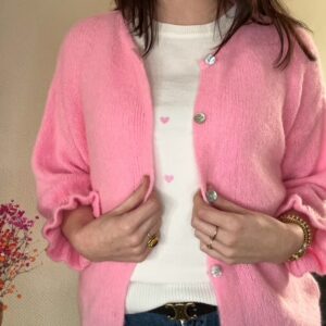 Knoopvestje licht roze met ruffles Stylefever