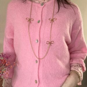 Roze knoop vestje met ruffles Stylefever